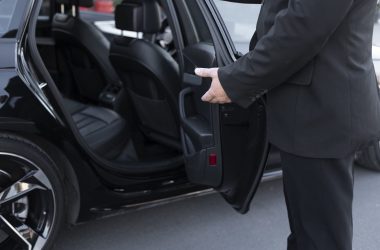 driver-with-opened-car-door
